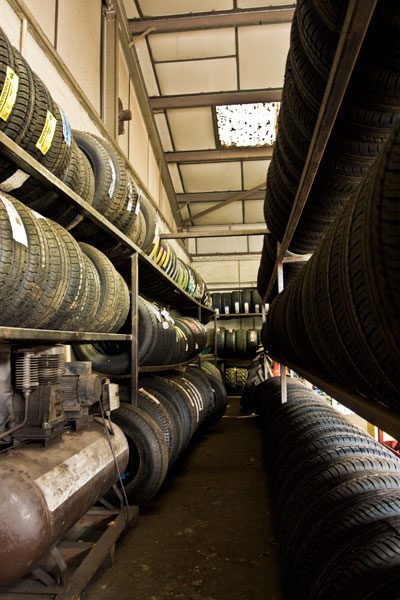 Tyre store at Tyre & Auto, racks of tyres