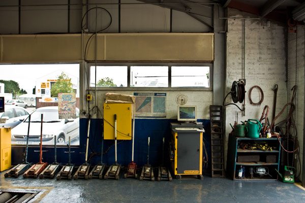 Workshop bay with trolley jacks and equipment