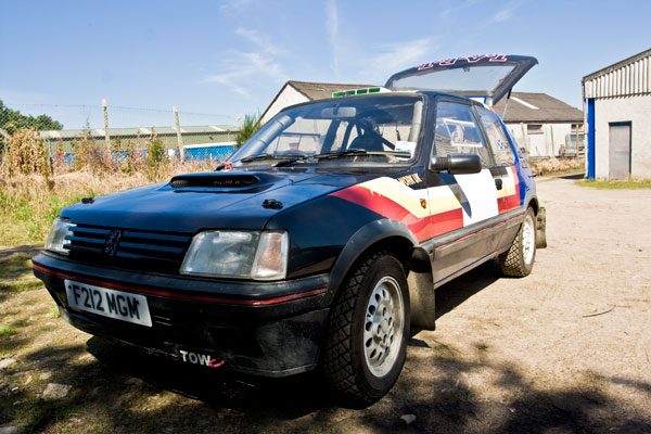 Peugeot 205 rally car in the yard