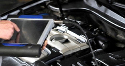 Diagnostic tablet connected to an engine
